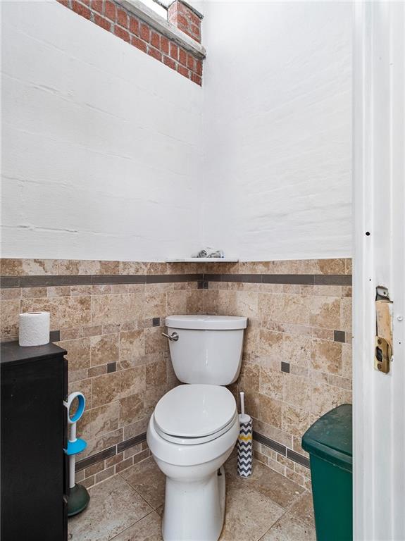 446 76th Street Brooklyn, NY 11209 - Photo 14 of 35 a bathroom with a toilet and a sink