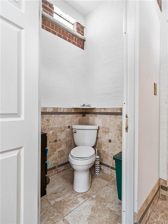 446 76th Street Brooklyn, NY 11209 - Photo 15 of 35 a bathroom with a toilet and a sink
