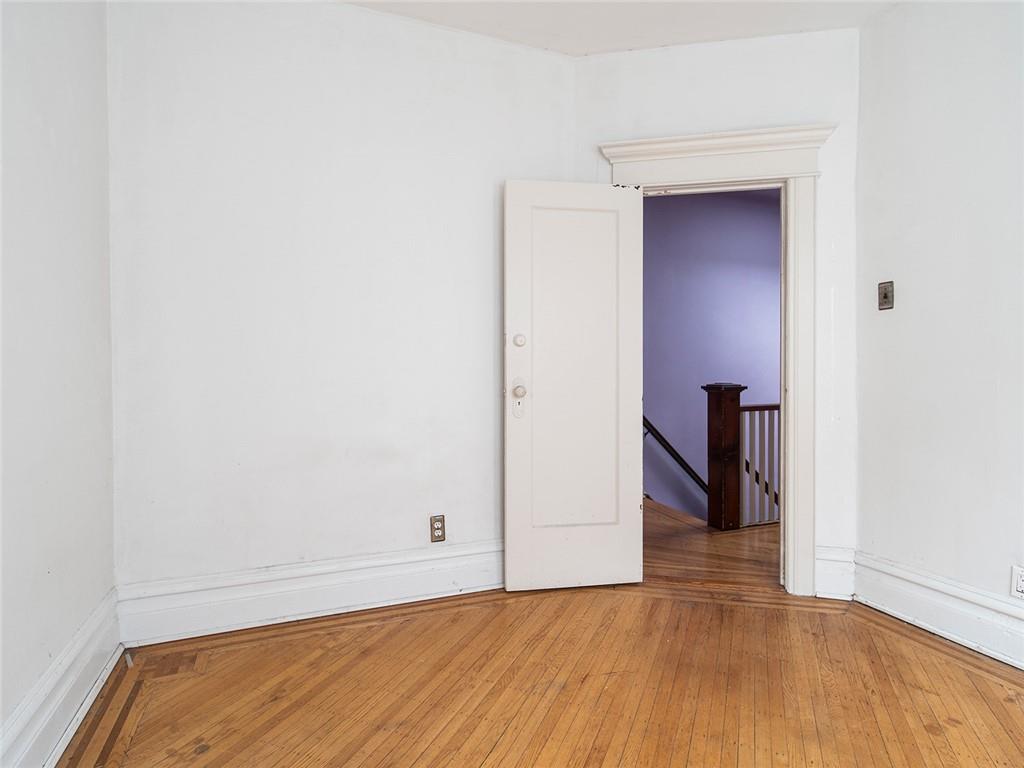 446 76th Street Brooklyn, NY 11209 - Photo 19 of 35 a view of hallway with wooden floor