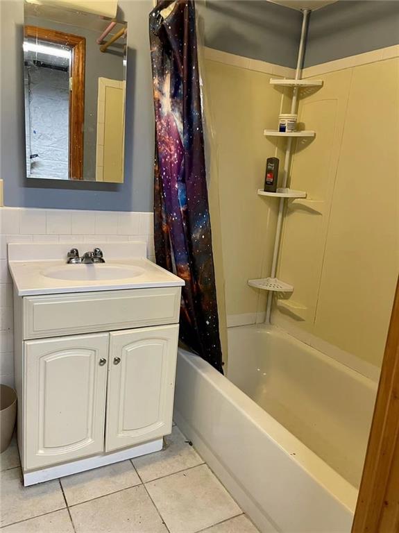 446 76th Street Brooklyn, NY 11209 - Photo 30 of 35 a bathroom with a sink a vanity and a mirror