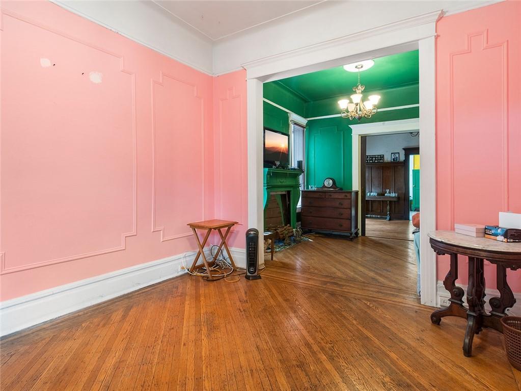 446 76th Street Brooklyn, NY 11209 - Photo 3 of 35 a living room with furniture and a wooden floor