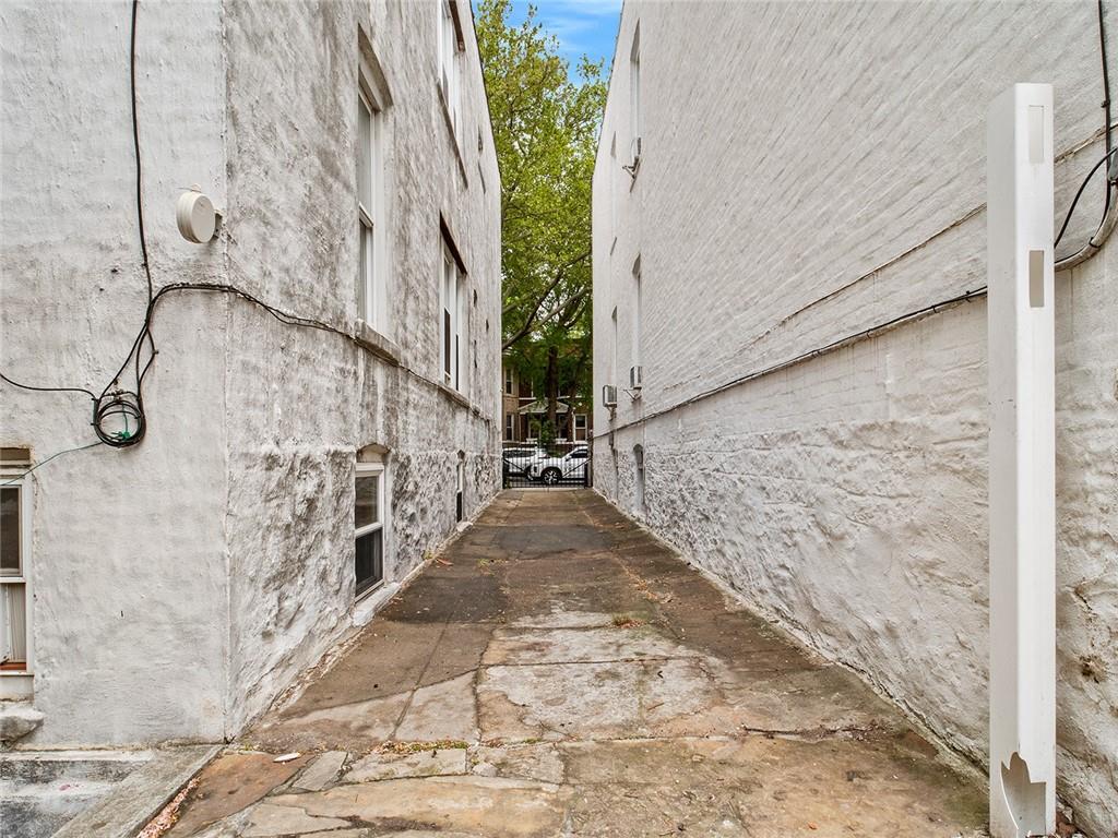 446 76th Street Brooklyn, NY 11209 - Photo 33 of 35 a view of a pathway both side of building