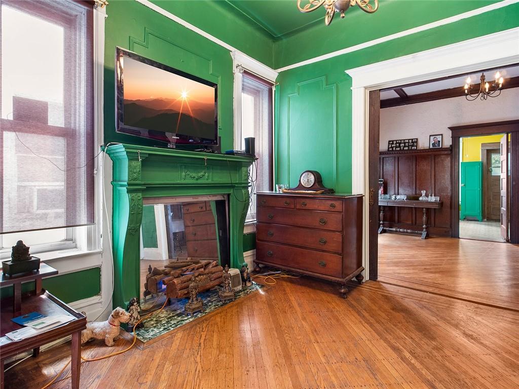 446 76th Street Brooklyn, NY 11209 - Photo 5 of 35 a living room with fireplace furniture and a flat screen tv