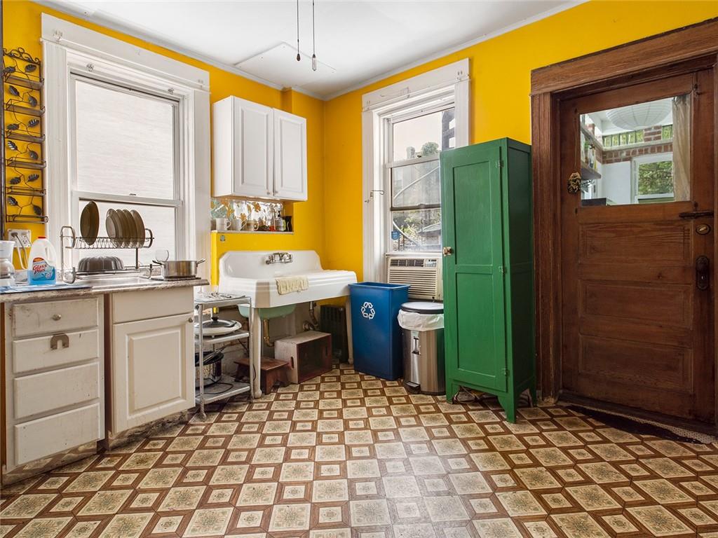 446 76th Street Brooklyn, NY 11209 - Photo 10 of 35 a bed room with a bed and a cabinets