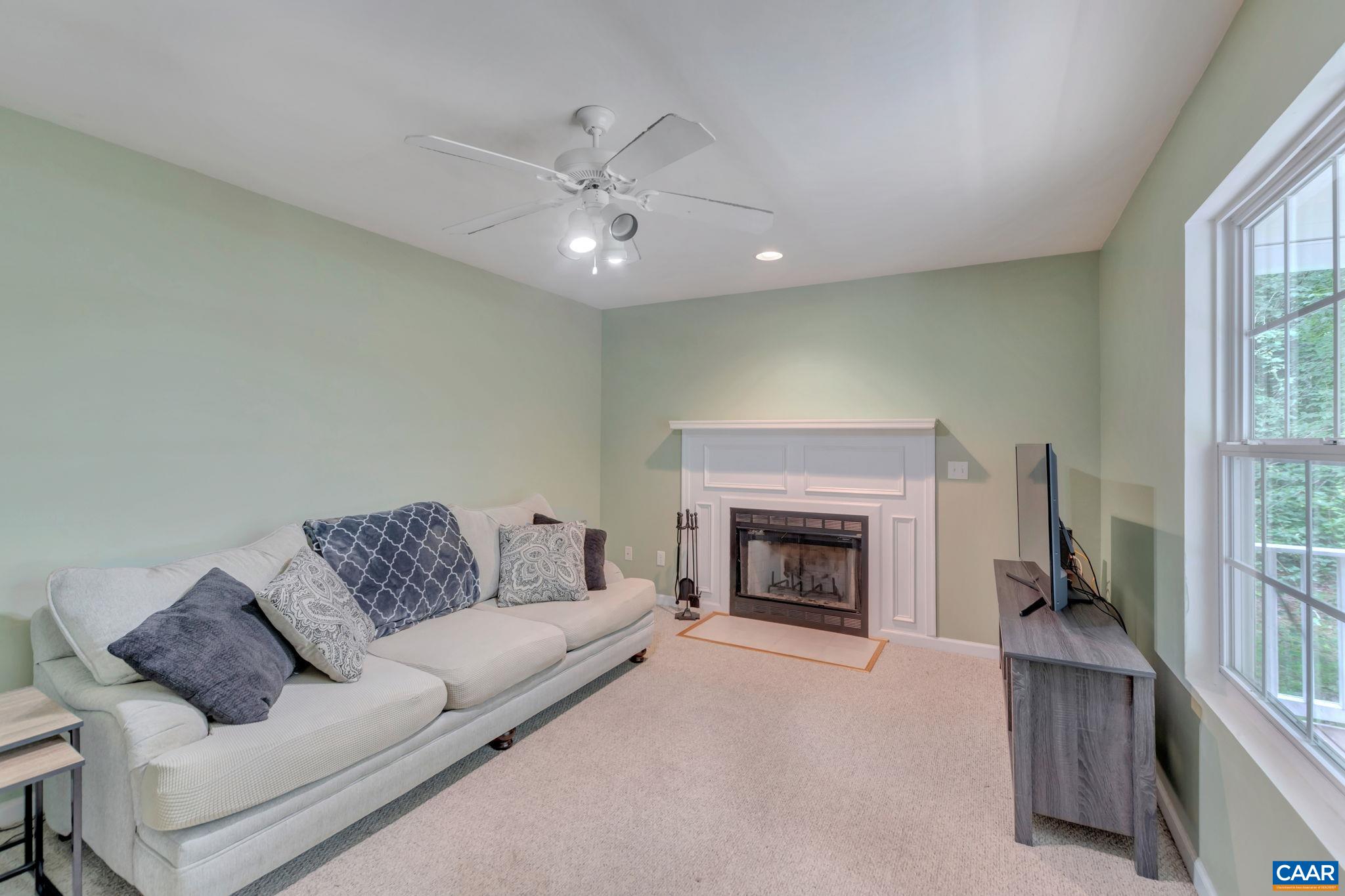 2 Riverside Drive Palmyra, VA 22963 - Photo 6 of 36 a living room with furniture and a fireplace