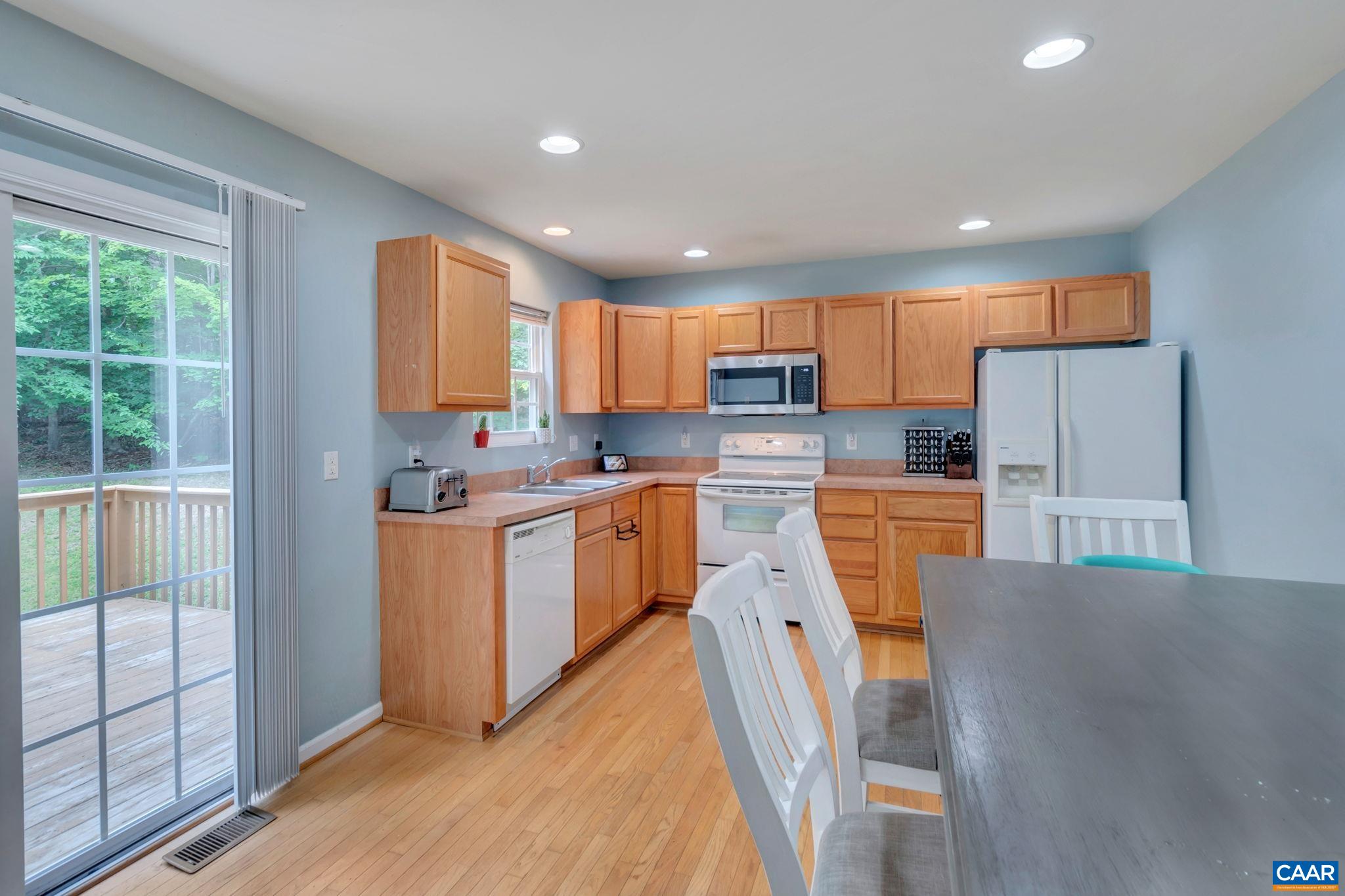 2 Riverside Drive Palmyra, VA 22963 - Photo 8 of 36 a kitchen with stainless steel appliances granite countertop a refrigerator sink stove microwave and cabinets