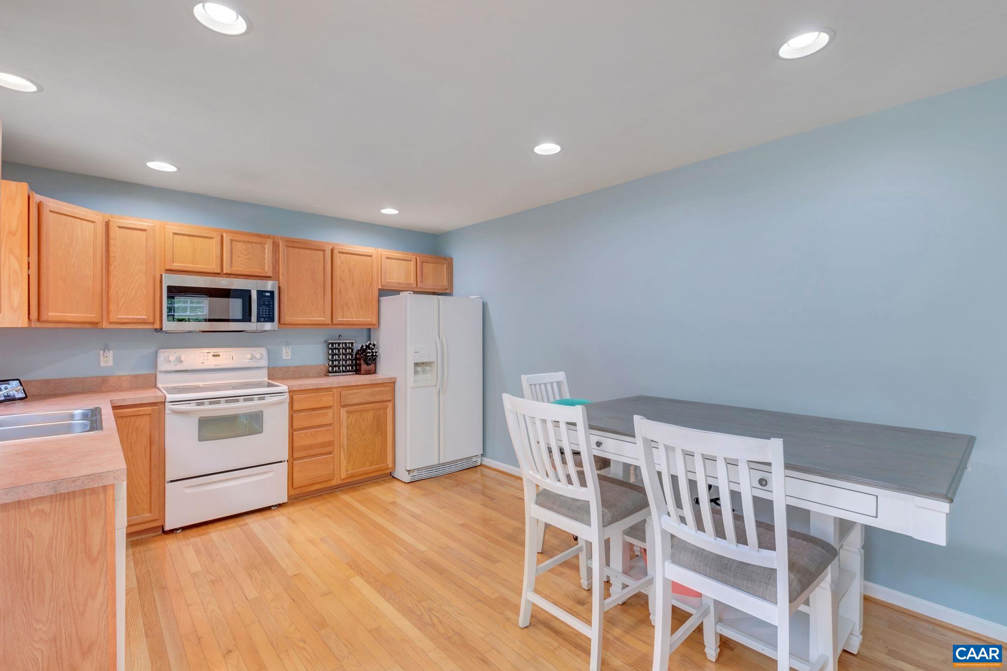 2 Riverside Drive Palmyra, VA 22963 - Photo 10 of 36 a kitchen with cabinets wooden floor and stainless steel appliances