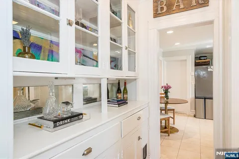 a kitchen with a white cabinets and a stove top oven