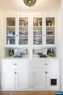 a kitchen with granite countertop a sink a stove and cabinets