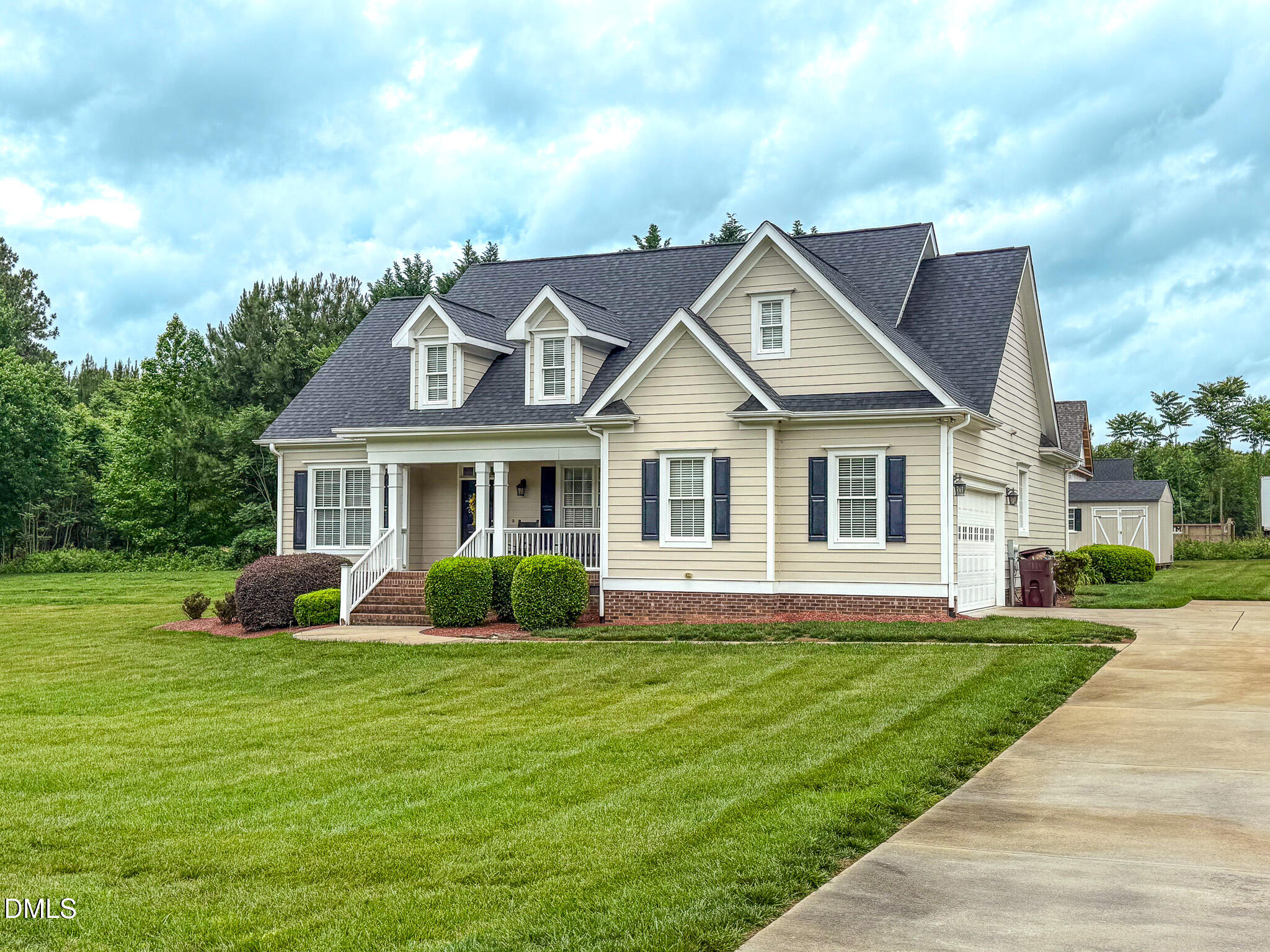 115 Duncan Plantation Road Timberlake, NC 27583 - Photo 6 of 48 a front view of a house with garden