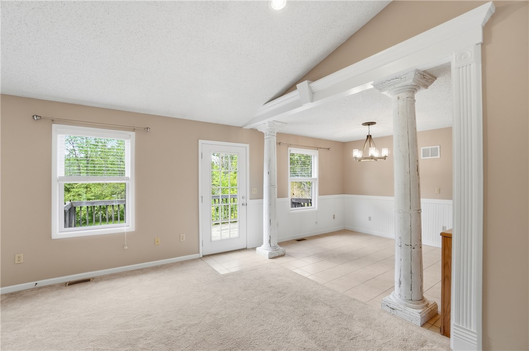 1208 Jarva Lane Springboro, OH 45066 - Photo 19 of 75 This bright living space features architectural columns and abundant natural light.
