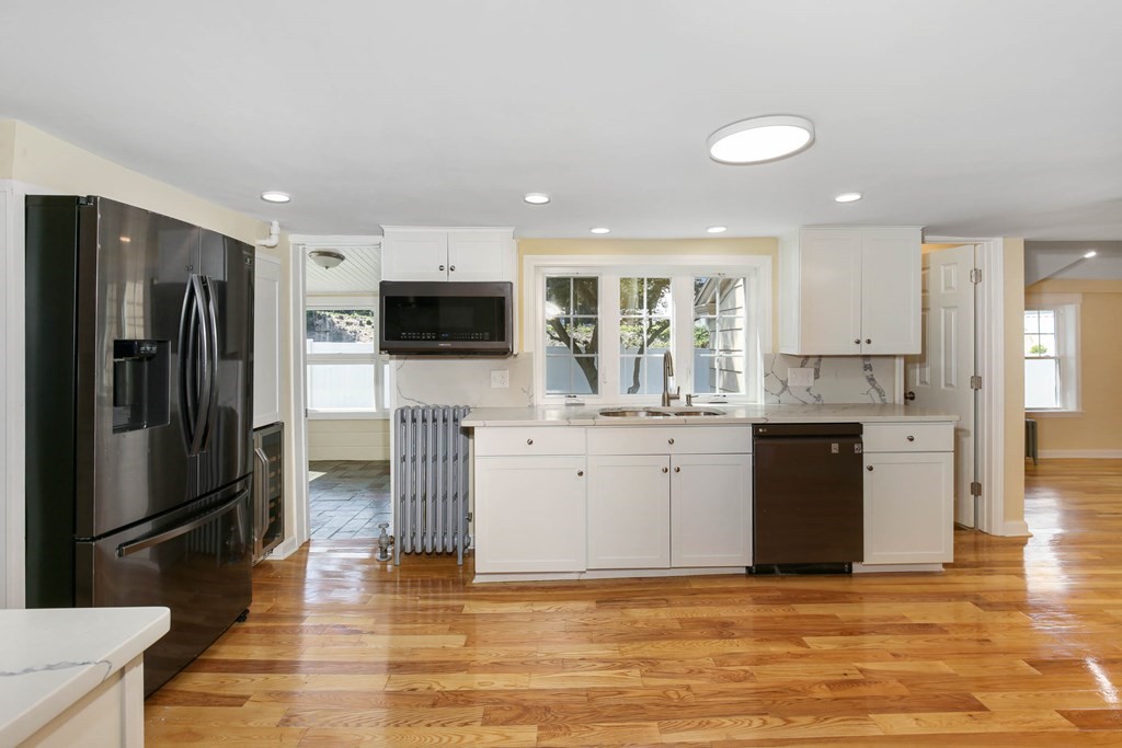 266 Webster Street Worcester, MA 01603 - Photo 14 of 42 a kitchen with stainless steel appliances granite countertop a refrigerator a stove a sink and a microwave