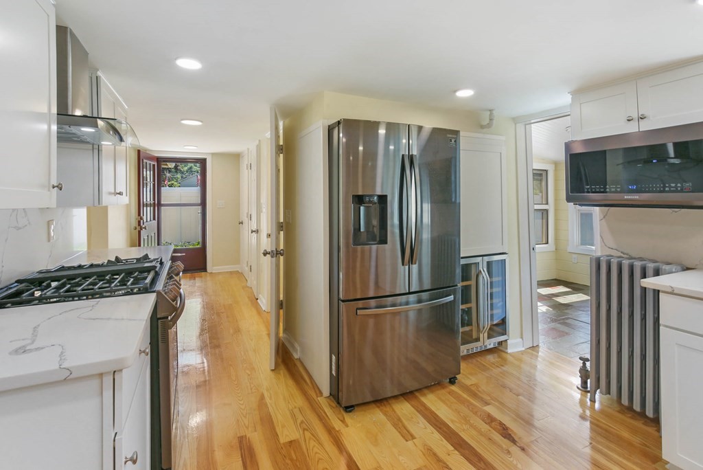 266 Webster Street Worcester, MA 01603 - Photo 17 of 42 a kitchen with stainless steel appliances granite countertop a refrigerator and a stove top oven
