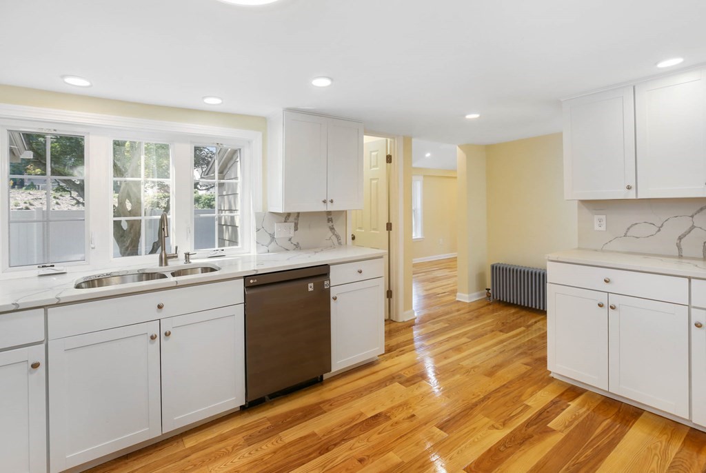 266 Webster Street Worcester, MA 01603 - Photo 18 of 42 a kitchen with white cabinets and sink