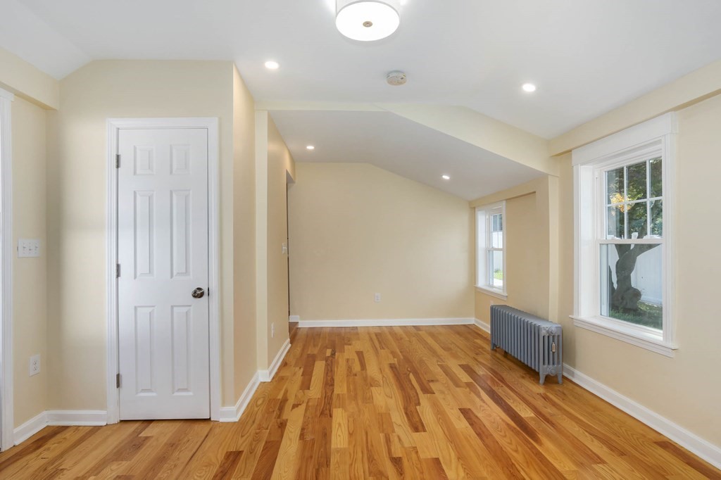 266 Webster Street Worcester, MA 01603 - Photo 21 of 42 a view of a room with wooden floor and windows