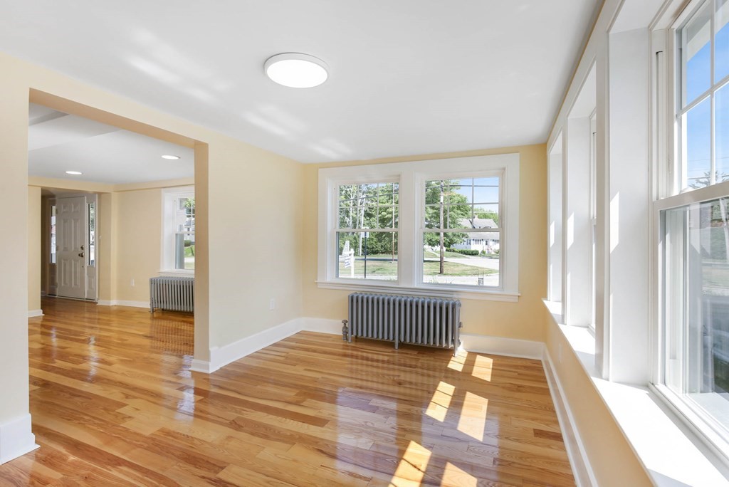 266 Webster Street Worcester, MA 01603 - Photo 29 of 42 a view of a room with wooden floor and windows