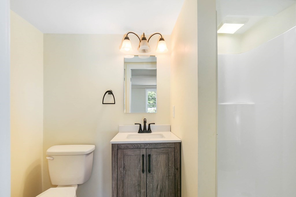 266 Webster Street Worcester, MA 01603 - Photo 31 of 42 a bathroom with a toilet sink and mirror