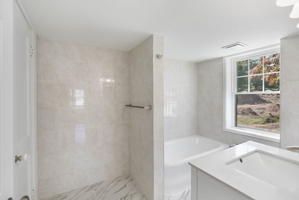 266 Webster Street Worcester, MA 01603 - Photo 34 of 42 a bathroom with a sink and a bathtub