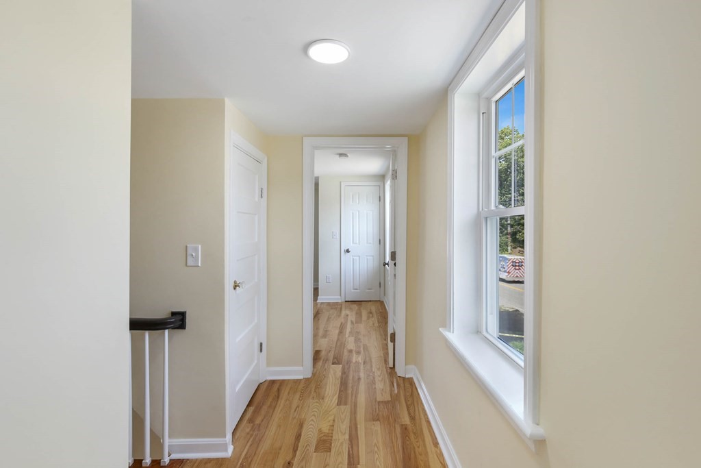 266 Webster Street Worcester, MA 01603 - Photo 38 of 42 a view of hallway with wooden floor