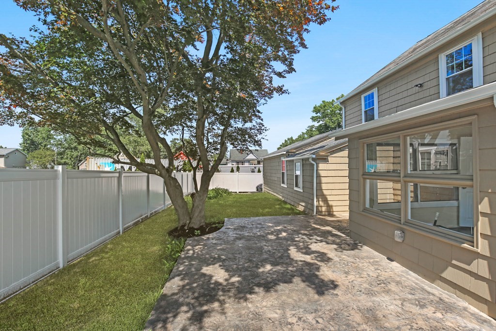 266 Webster Street Worcester, MA 01603 - Photo 10 of 42 a view of a house with a yard