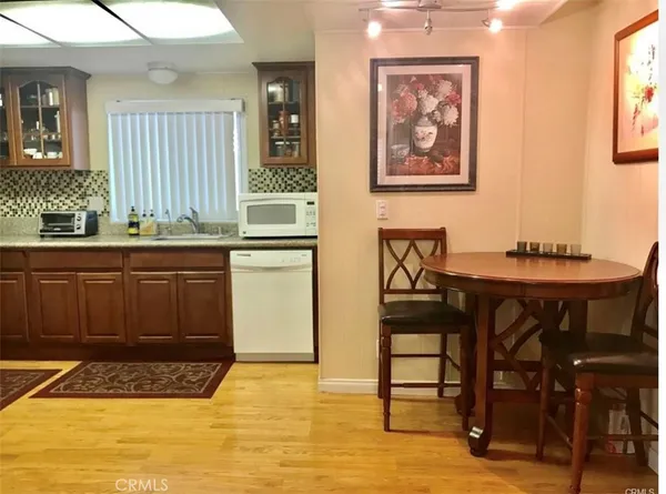a kitchen with a table and chairs in it
