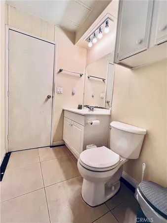 a bathroom with a toilet a sink and a shower