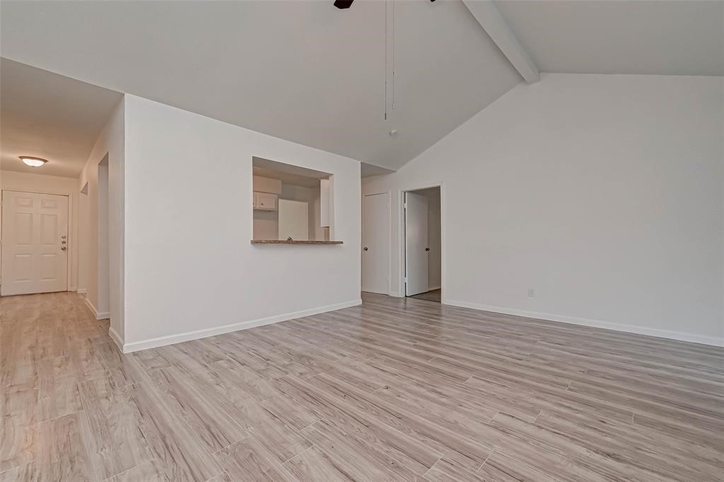 5503 Lynngate Drive Spring, TX 77373 - Photo 9 of 15 a view of an empty room with wooden floor