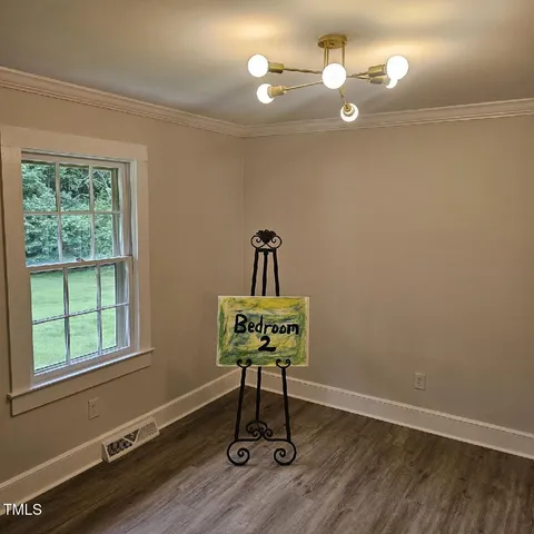 a room with a chair and a mirror