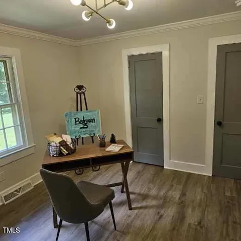 a bathroom with a sink a mirror and a shower