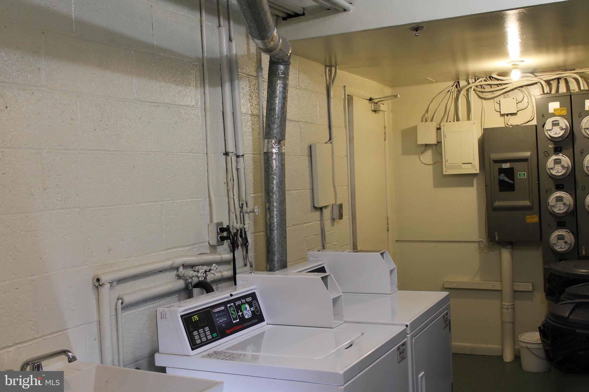 112 Cross Keys Road, Unit R112E Baltimore, MD 21210 - Photo 15 of 19 Common area- laundry on the lower level
