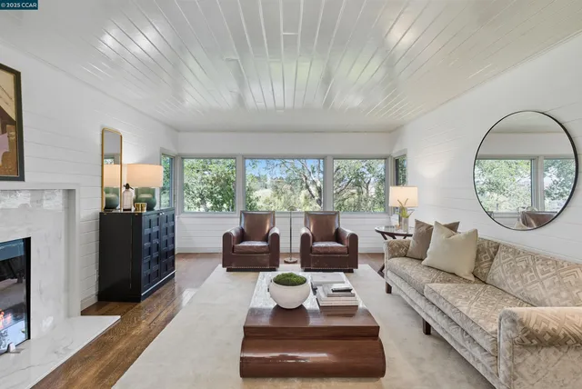 a view of a dining room with furniture window and outside view