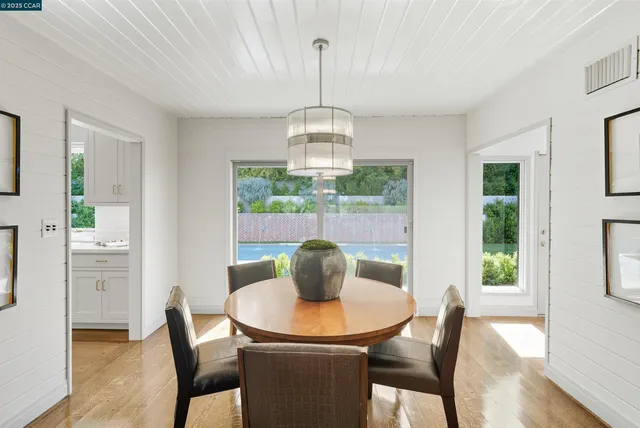 a kitchen with a sink and large window