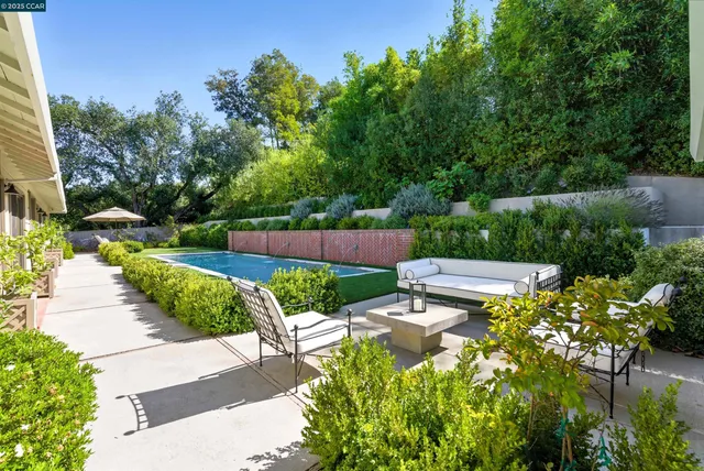 a view of a chairs and table in the patio