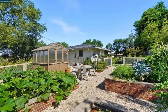 a view of swimming pool with seating area