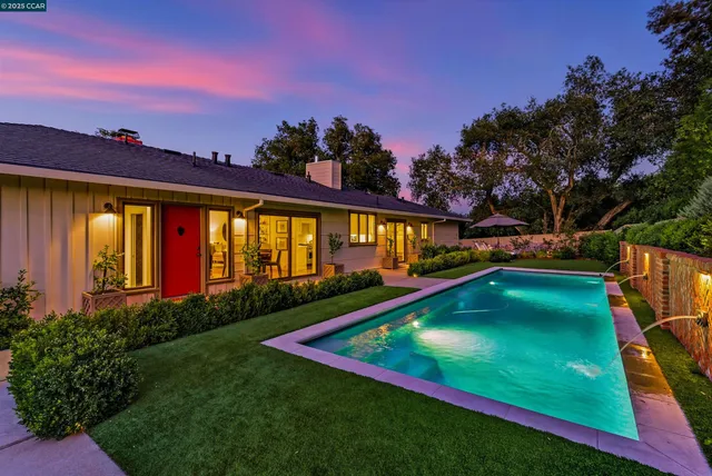 a view of a pathway with a house in the background