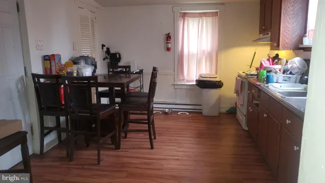a view of a dining room with furniture and window