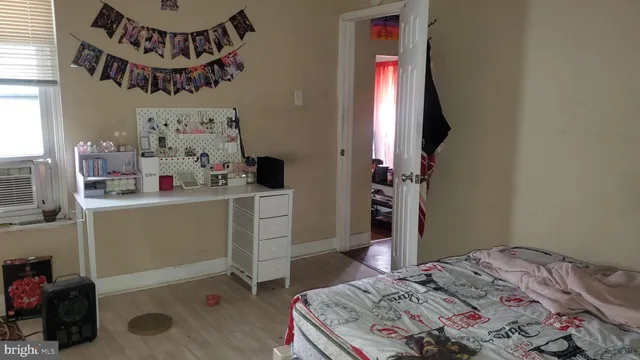 a bedroom with a bed and a window in it