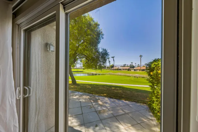 a view of swimming pool from a window