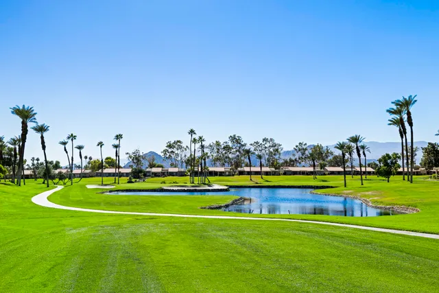 a view of a golf course with a lake view