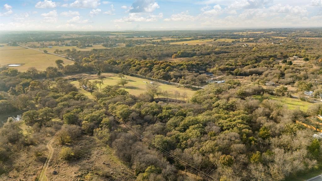 223 West Gaithings Covington, TX 76636 - Photo 11 of 22 Aerial view of property and surrounding area featuring rural landscape
