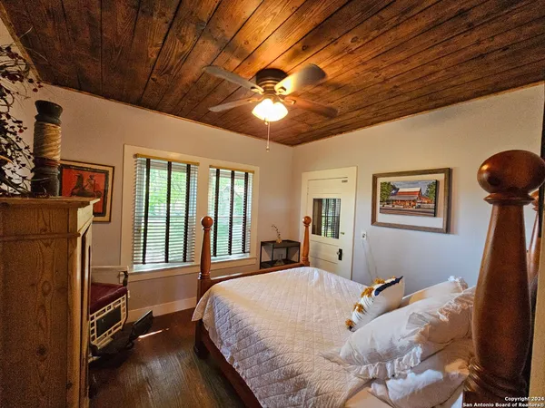 a bed room with a bed and a chandelier