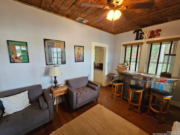 a living room with furniture and a window