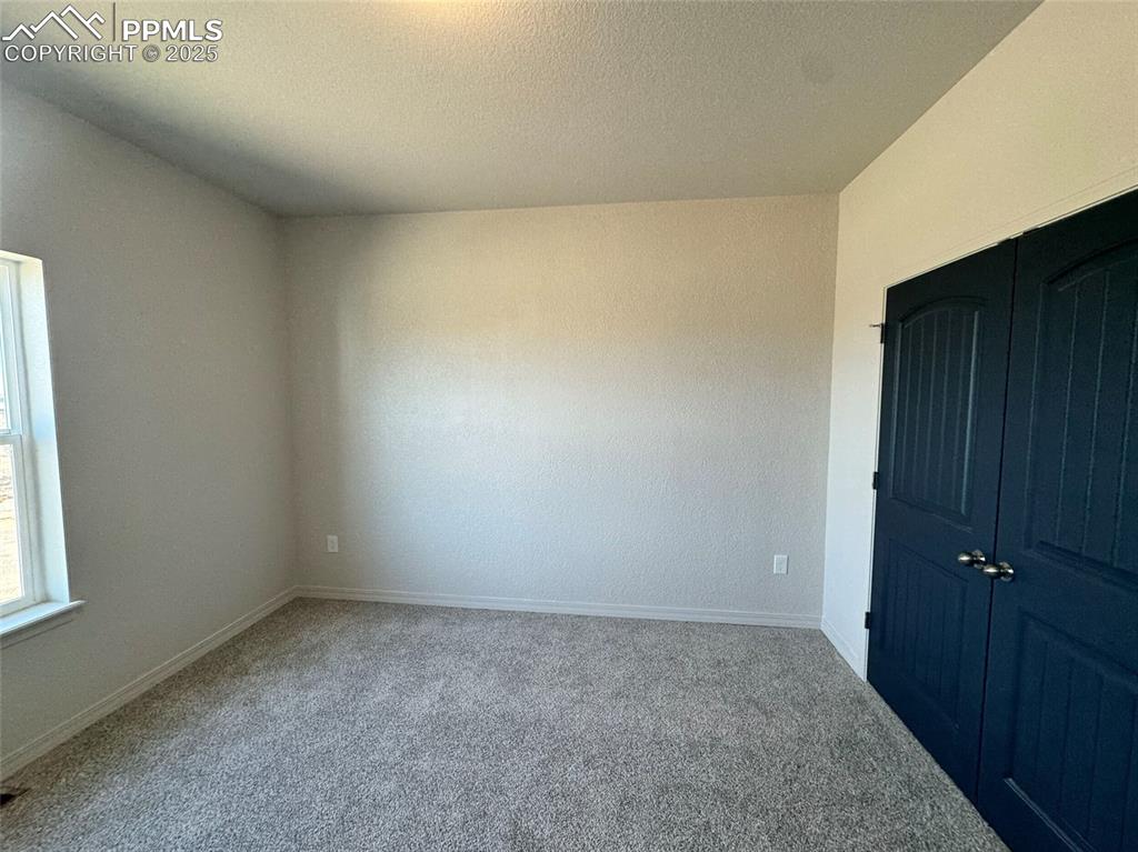 3955 Yoder Road Yoder, CO 80864 - Photo 13 of 27 View of carpeted empty room
