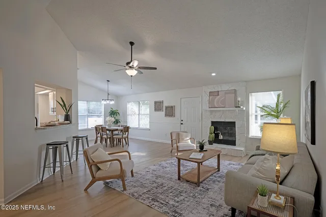 a living room with furniture and a fireplace