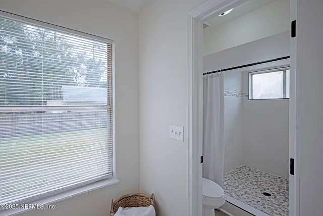 a view of room with window and closet