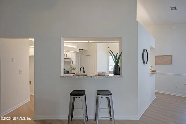 a view of kitchen with wooden floor and chair