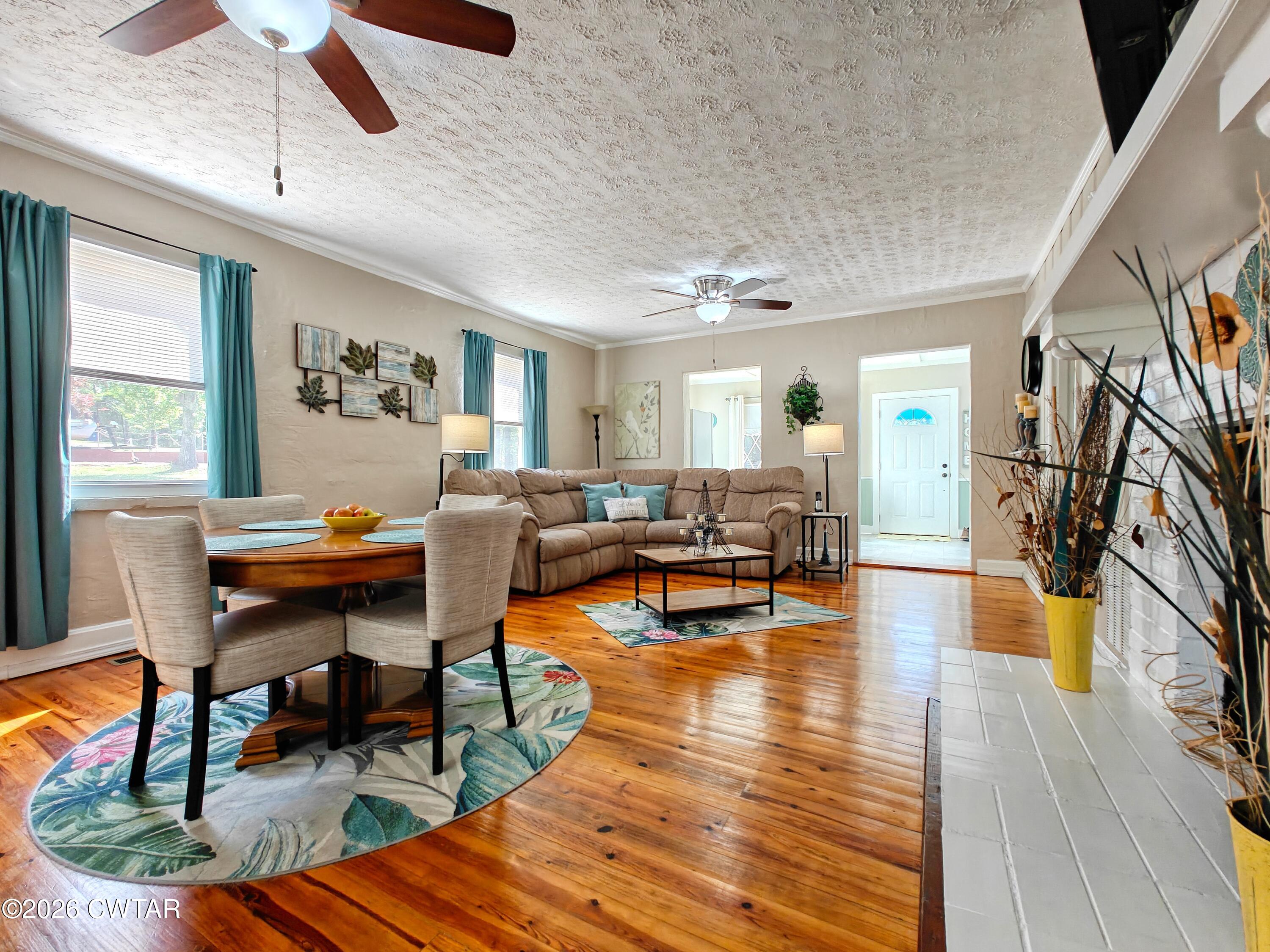 195 Coast Guard Road Buchanan, TN 38222 - Photo 12 of 34 a living room with fireplace furniture and a wooden floor