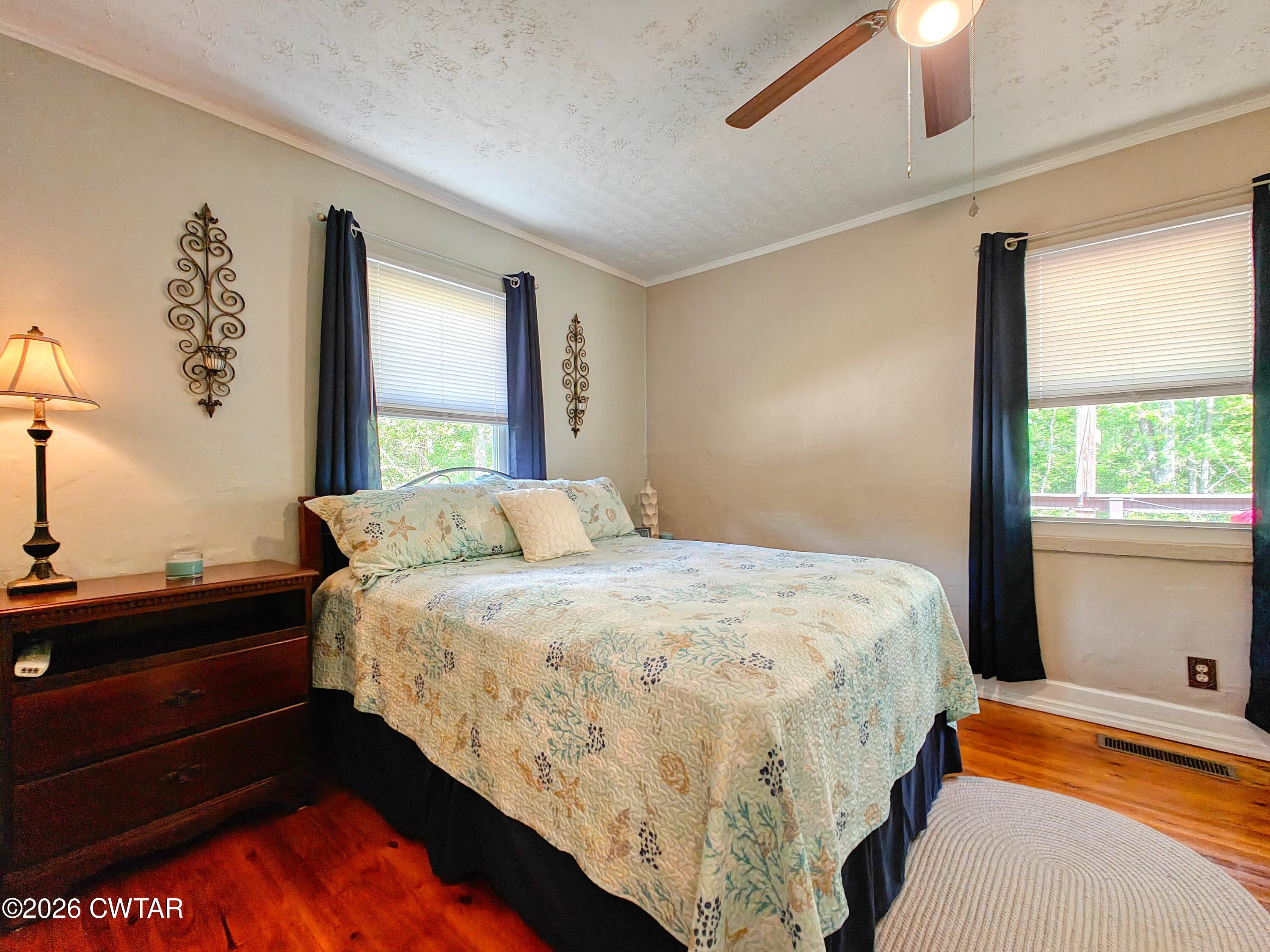 195 Coast Guard Road Buchanan, TN 38222 - Photo 19 of 34 a bedroom with a bed and window