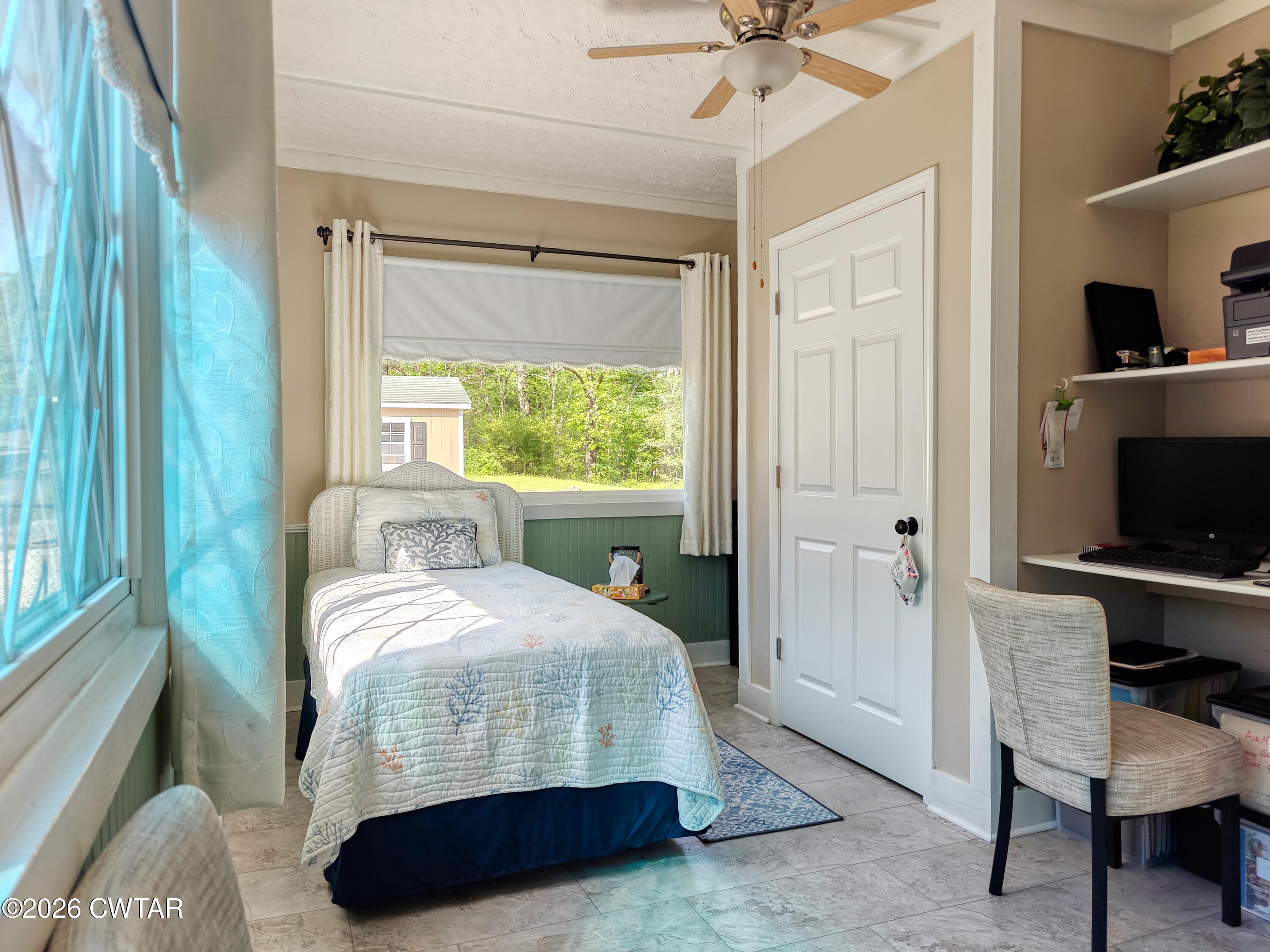 195 Coast Guard Road Buchanan, TN 38222 - Photo 25 of 34 a bedroom with a bed and a window