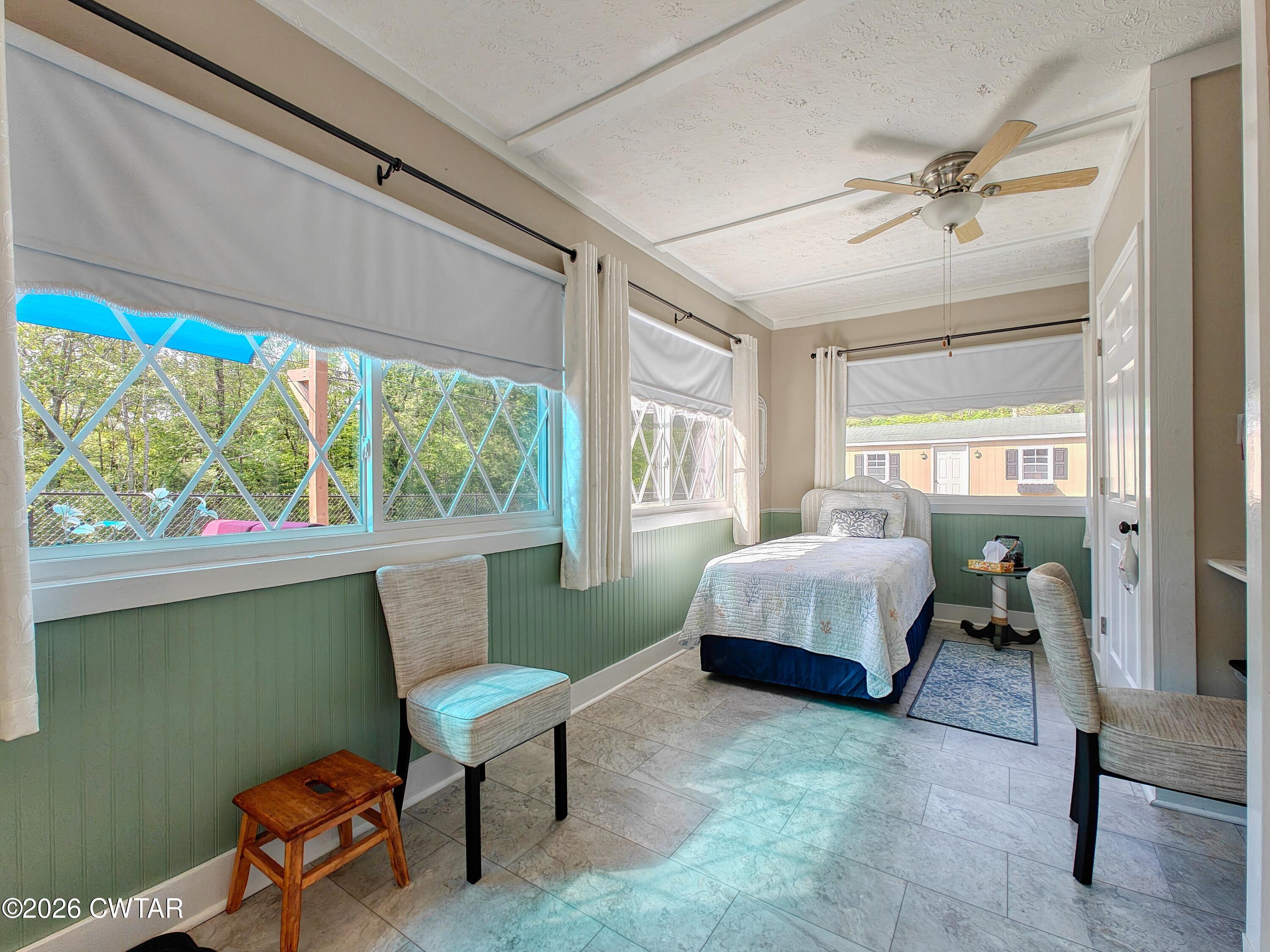 195 Coast Guard Road Buchanan, TN 38222 - Photo 26 of 34 a bedroom with a bed and a window